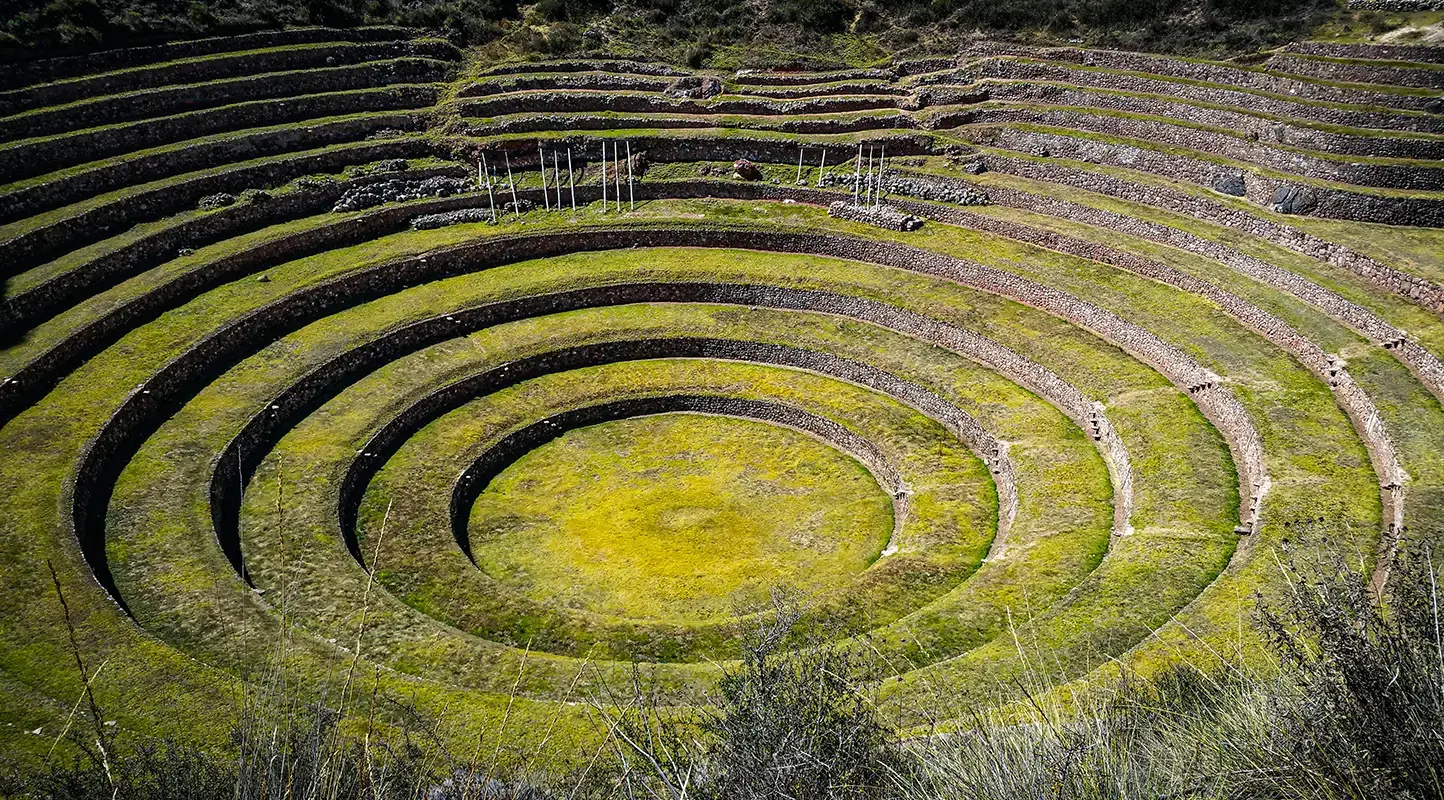 Panoramic view of the Maras Salt Mines and the circular terraces of Moray in the Sacred Valley, Cusco, Peru